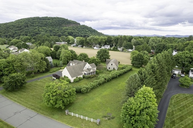 birds eye view of property with a wooded view