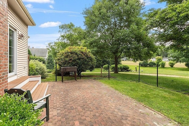 view of patio featuring fence