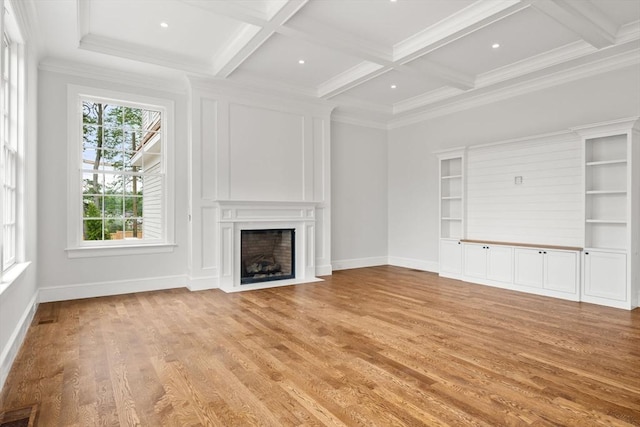 61 Heath St, Brookline, MA 02445 - unfurnished living room featuring a fireplace with flush hearth, beamed ceiling, light wood-style flooring, baseboards, and coffered ceiling