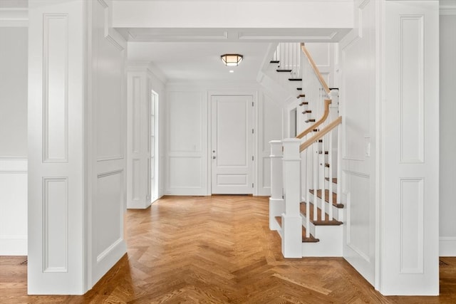 61 Heath St, Brookline, MA 02445 - foyer entrance featuring stairs and ornamental molding