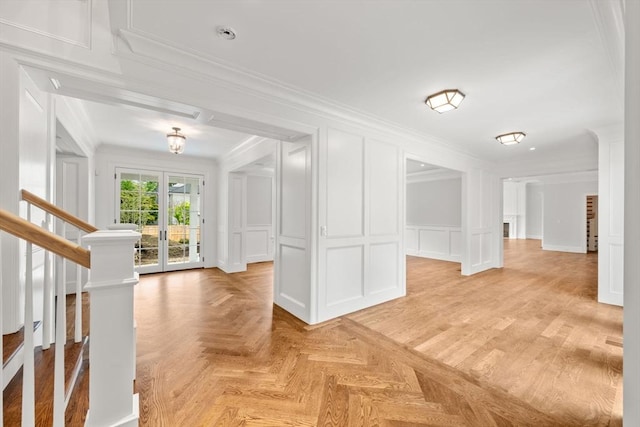 61 Heath St, Brookline, MA 02445 - spare room with a decorative wall, crown molding, and stairway