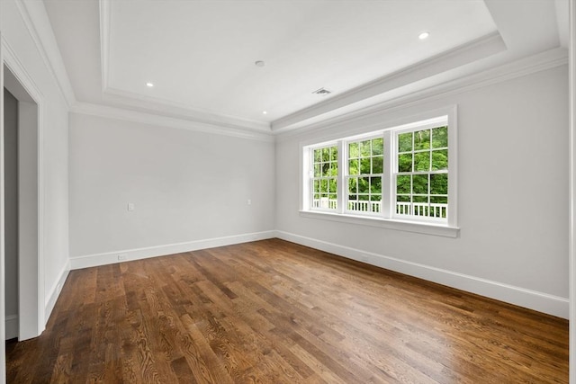61 Heath St, Brookline, MA 02445 - spare room with a tray ceiling, baseboards, wood finished floors, crown molding, and recessed lighting