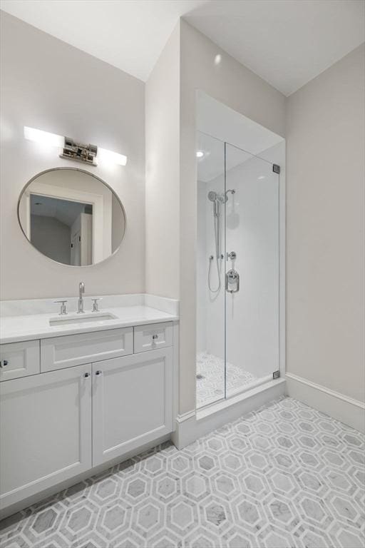 61 Heath St, Brookline, MA 02445 - bathroom with a shower stall, vanity, and baseboards