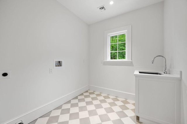 61 Heath St, Brookline, MA 02445 - washroom with cabinet space, light flooring, electric dryer hookup, hookup for a washing machine, and baseboards