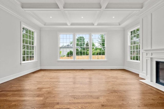 61 Heath St, Brookline, MA 02445 - unfurnished living room featuring a fireplace with flush hearth, coffered ceiling, light wood-style floors, baseboards, and beamed ceiling