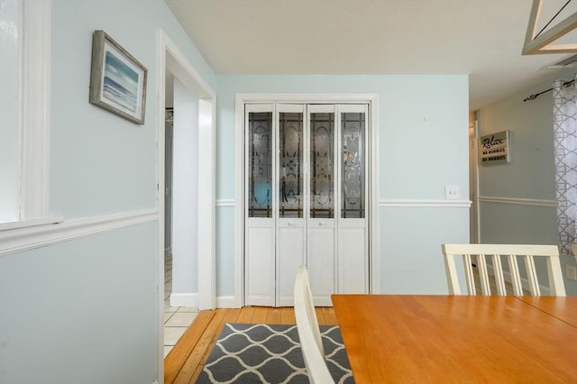 dining space with light wood-type flooring