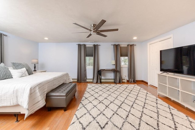 bedroom featuring ceiling fan and light wood-type flooring