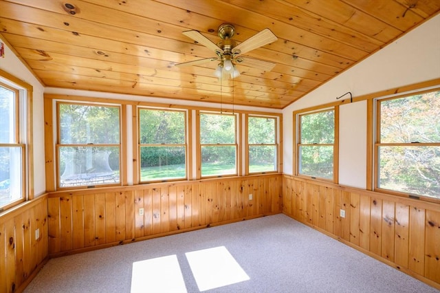 unfurnished sunroom featuring ceiling fan, wooden ceiling, and vaulted ceiling