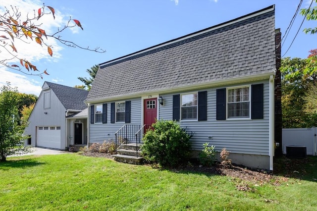 view of front facade with a front yard and a garage