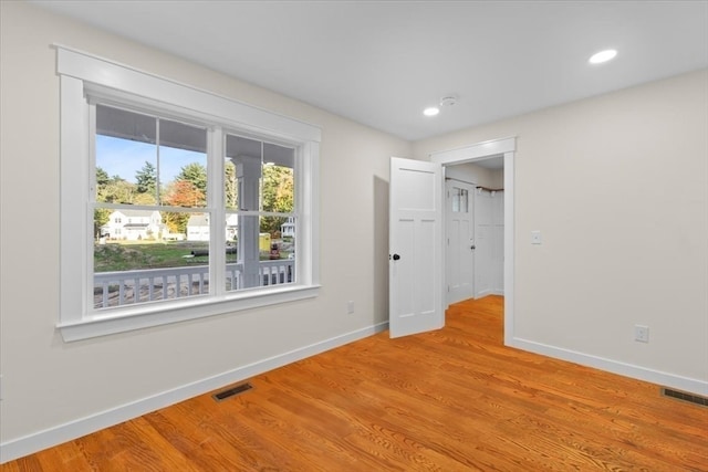 unfurnished bedroom with light wood-type flooring