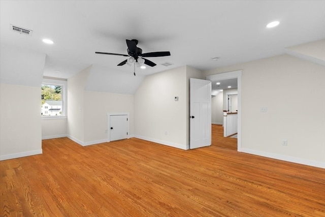 bonus room with ceiling fan, vaulted ceiling, and light hardwood / wood-style floors