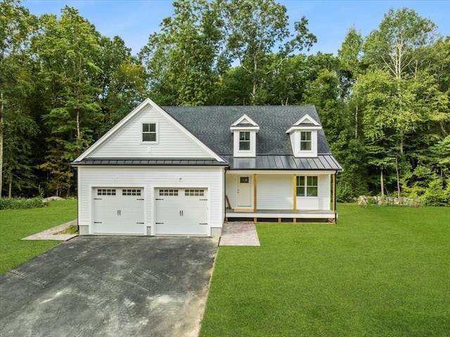 view of front of house with a garage, a porch, and a front yard