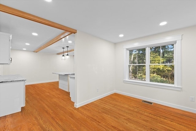 unfurnished living room featuring light hardwood / wood-style floors