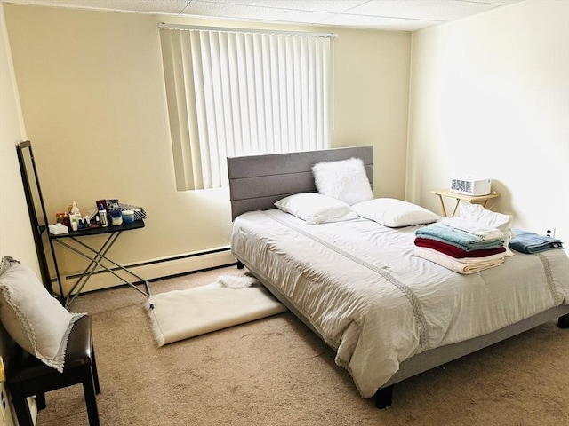 carpeted bedroom featuring a baseboard radiator