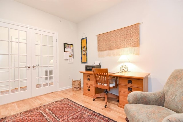 office featuring baseboards and wood finished floors