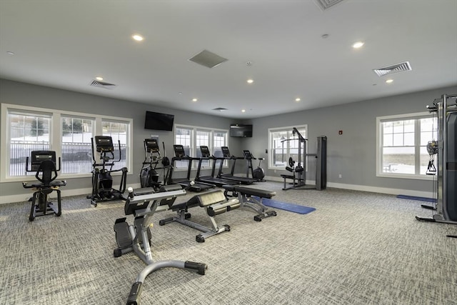 exercise room with visible vents and carpet flooring