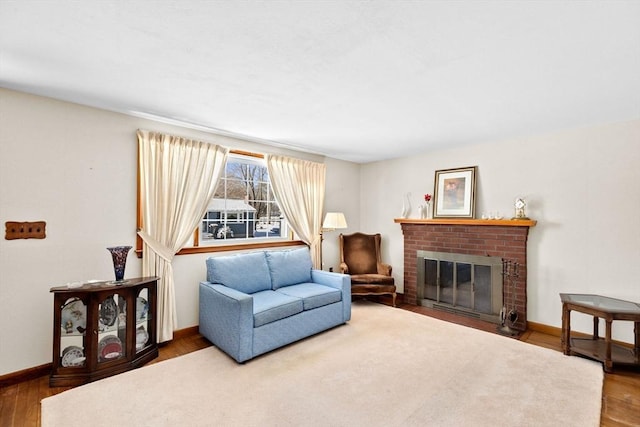 living room featuring a fireplace and wood-type flooring