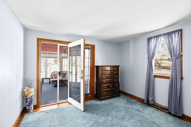 interior space with carpet and french doors