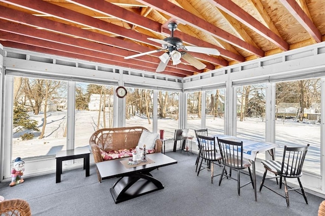 sunroom / solarium featuring ceiling fan and vaulted ceiling