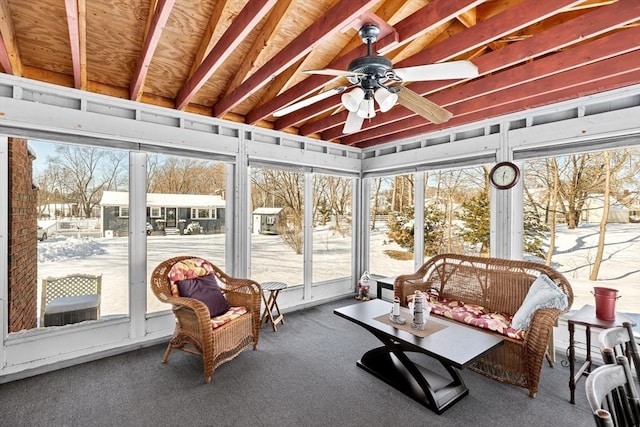 sunroom featuring ceiling fan