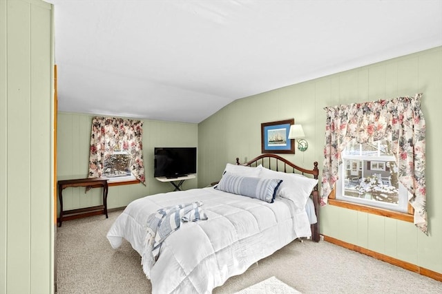 carpeted bedroom with vaulted ceiling