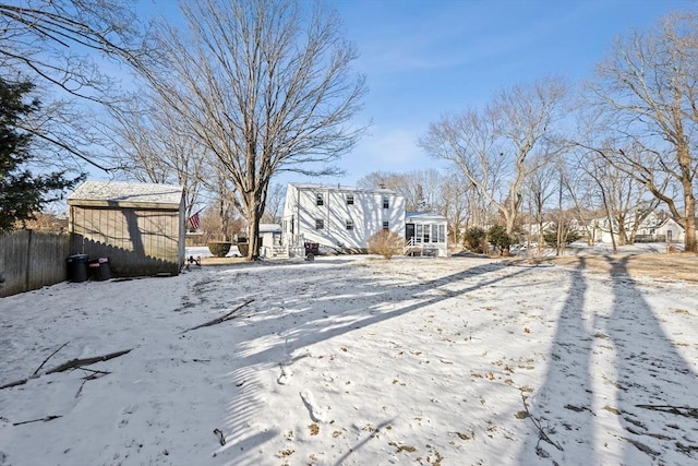 view of yard layered in snow