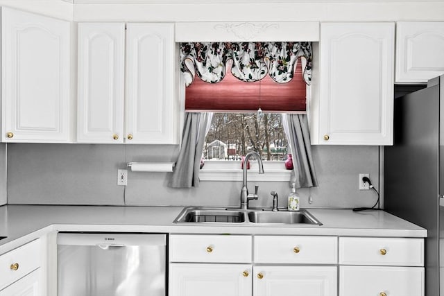 kitchen featuring white cabinetry, stainless steel appliances, and sink