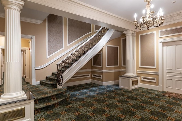 staircase featuring a notable chandelier and crown molding