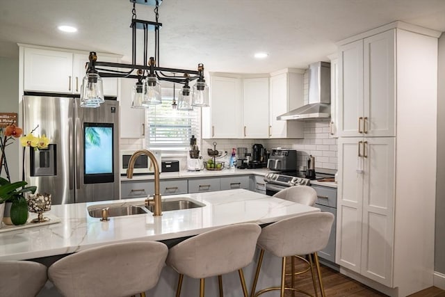 22 Hillsdale Rd, Holbrook, MA 02343 - kitchen with appliances with stainless steel finishes, wall chimney range hood, white cabinets, decorative backsplash, and recessed lighting