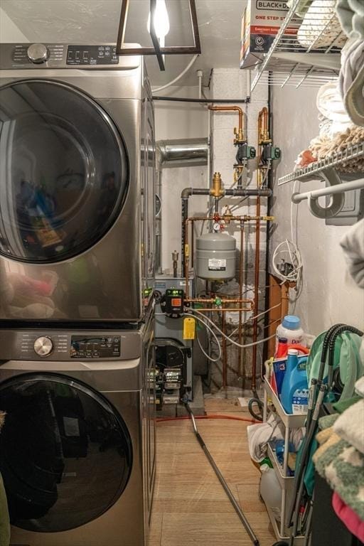22 Hillsdale Rd, Holbrook, MA 02343 - laundry room featuring estacked washer and dryer and a heating unit