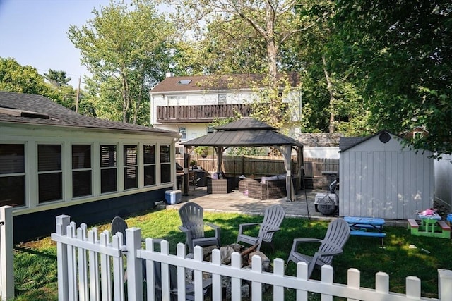 22 Hillsdale Rd, Holbrook, MA 02343 - fenced backyard with an outdoor living space, a patio, a storage shed, and a gazebo