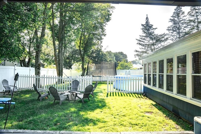 22 Hillsdale Rd, Holbrook, MA 02343 - fenced backyard with a trampoline