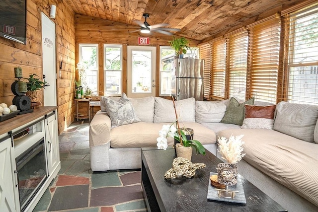 22 Hillsdale Rd, Holbrook, MA 02343 - living area featuring lofted ceiling, ceiling fan, wooden ceiling, wood walls, and stone finish floors