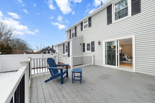 wooden terrace featuring fence