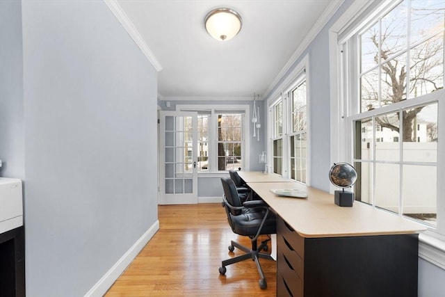 office area with baseboards, crown molding, and light wood finished floors