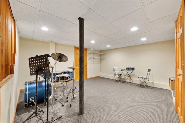 exercise room with carpet floors, baseboards, a drop ceiling, and recessed lighting