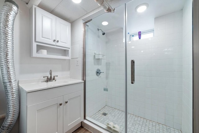 bathroom featuring a stall shower and vanity