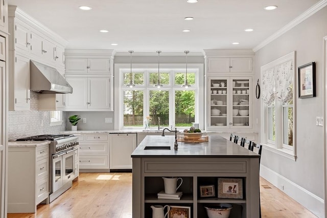 59 Elm St, Concord, MA 01742 - kitchen featuring double oven range, open shelves, wall chimney exhaust hood, white dishwasher, and white cabinetry