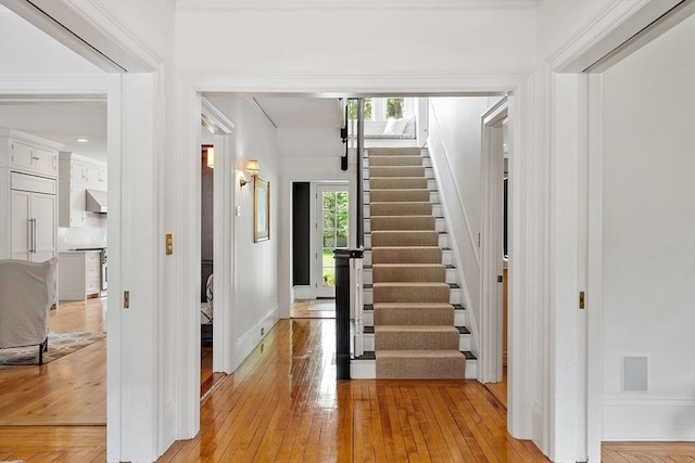 59 Elm St, Concord, MA 01742 - foyer entrance featuring stairway, light wood-type flooring, and baseboards