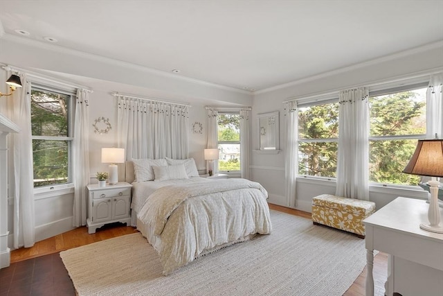 59 Elm St, Concord, MA 01742 - bedroom with wood finished floors, ornamental molding, and baseboards