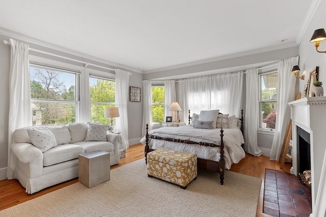 59 Elm St, Concord, MA 01742 - bedroom with ornamental molding, a fireplace with flush hearth, and wood finished floors