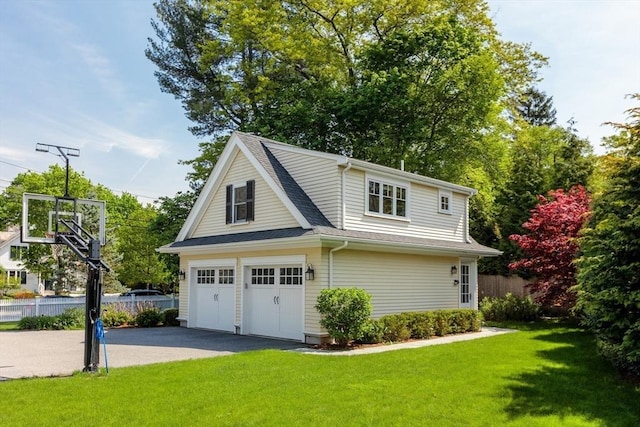 59 Elm St, Concord, MA 01742 - view of side of property featuring a garage and a shingled roof