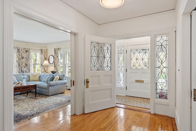 59 Elm St, Concord, MA 01742 - foyer featuring light wood-style flooring and ornamental molding