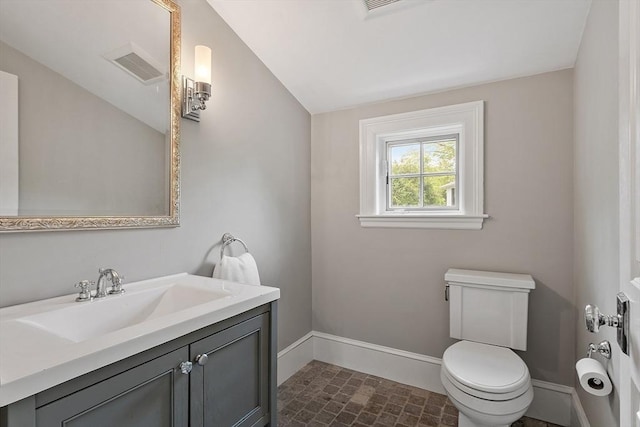 59 Elm St, Concord, MA 01742 - half bath with baseboards, toilet, and vanity