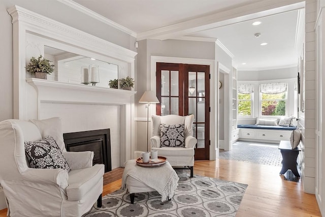 59 Elm St, Concord, MA 01742 - sitting room featuring wood finished floors, recessed lighting, crown molding, and a glass covered fireplace