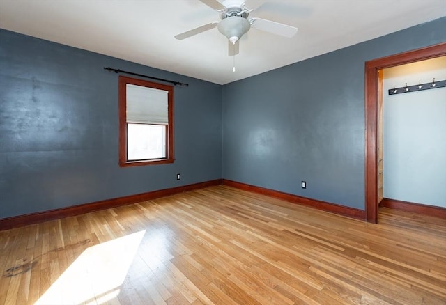 spare room featuring ceiling fan and light hardwood / wood-style flooring