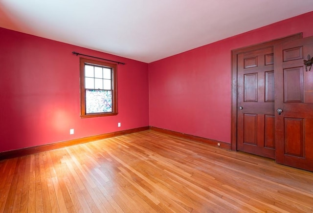 spare room featuring light wood-type flooring