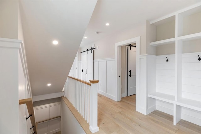 2 Candle House Ln, Nantucket, MA 02564 - mudroom with a wainscoted wall, recessed lighting, a barn door, and light wood-style floors