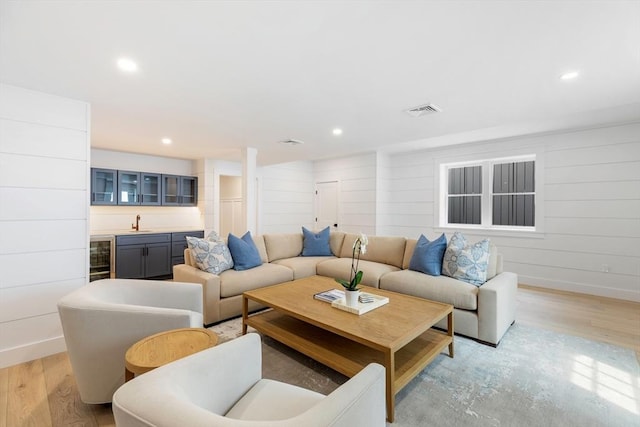 2 Candle House Ln, Nantucket, MA 02564 - living room with indoor wet bar, light wood-type flooring, visible vents, wine cooler, and baseboards
