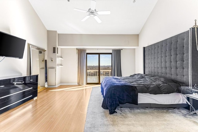 bedroom featuring a ceiling fan, wood finished floors, visible vents, baseboards, and access to outside